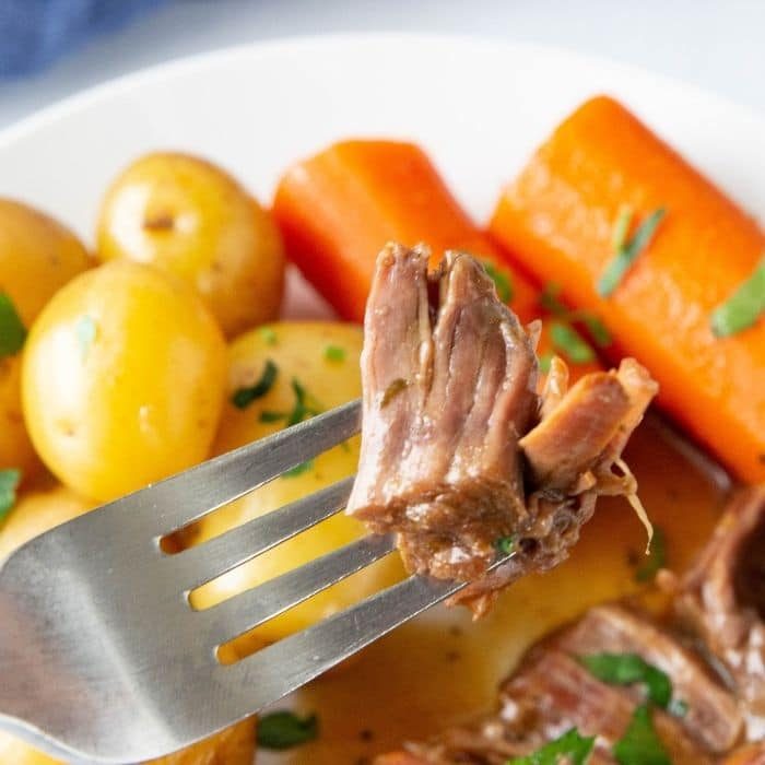 fork with pot roast on it