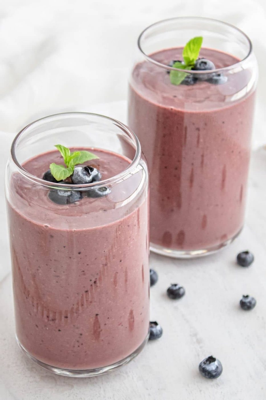 smoothies in two cups on table