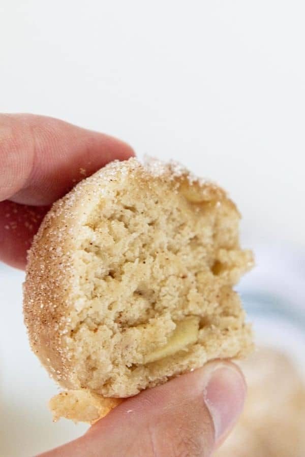 holding apple cider muffin bites 