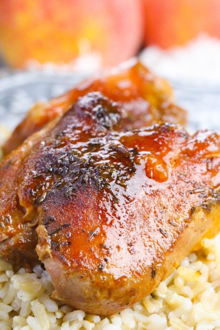 peach bbq chicken on plate with rice