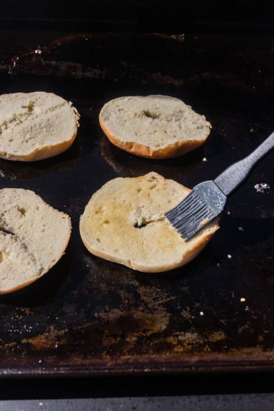 bagel being buttered on blackstone 