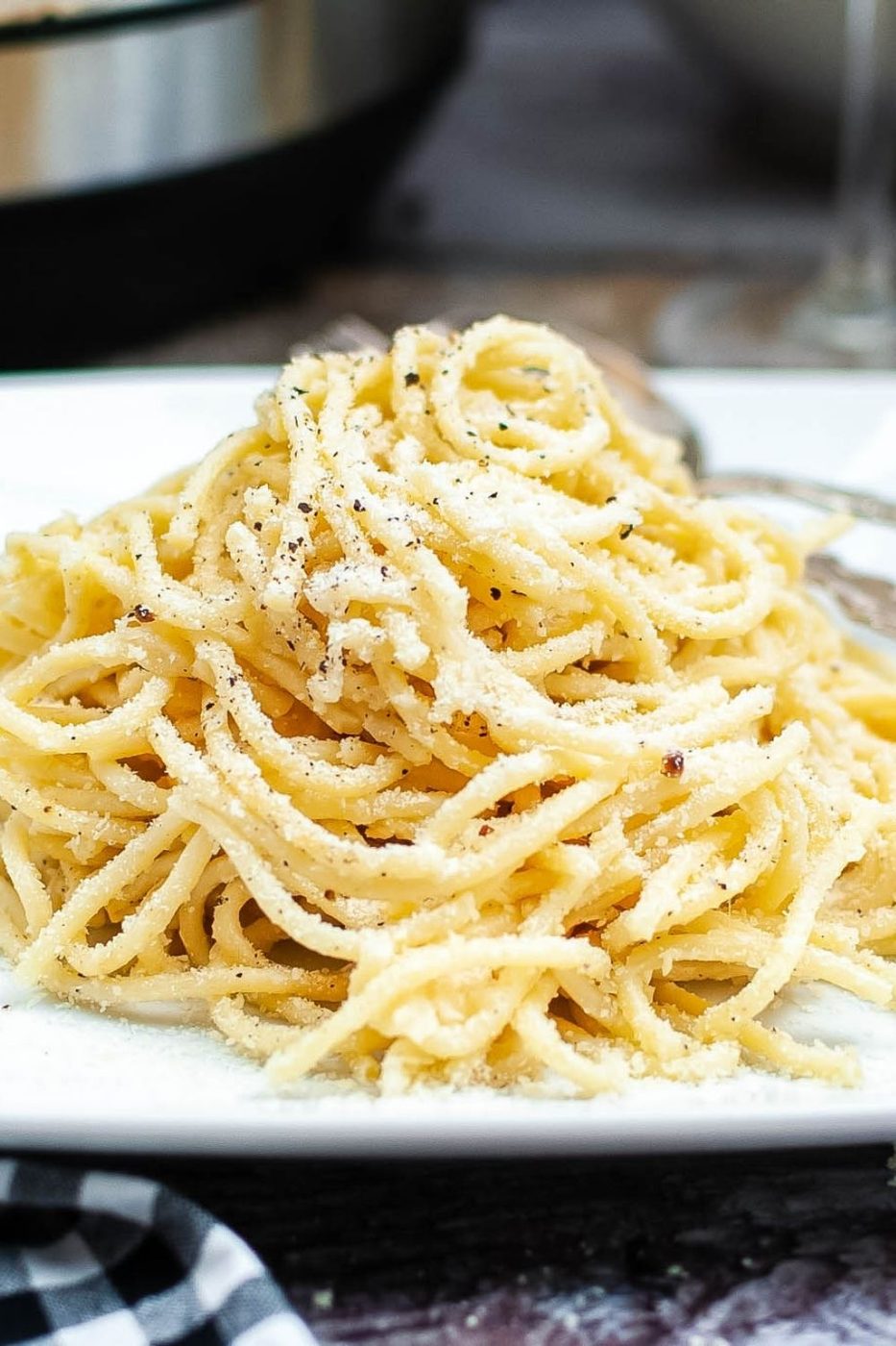 salt and pepper pasta piled on a plate 