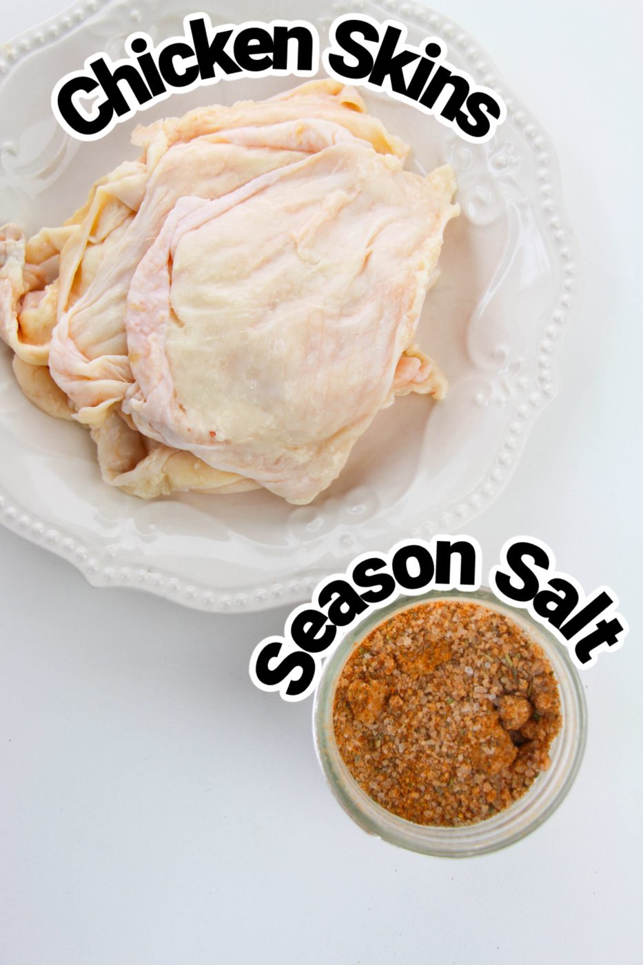 ingredients for making chicken skins on white counter 
