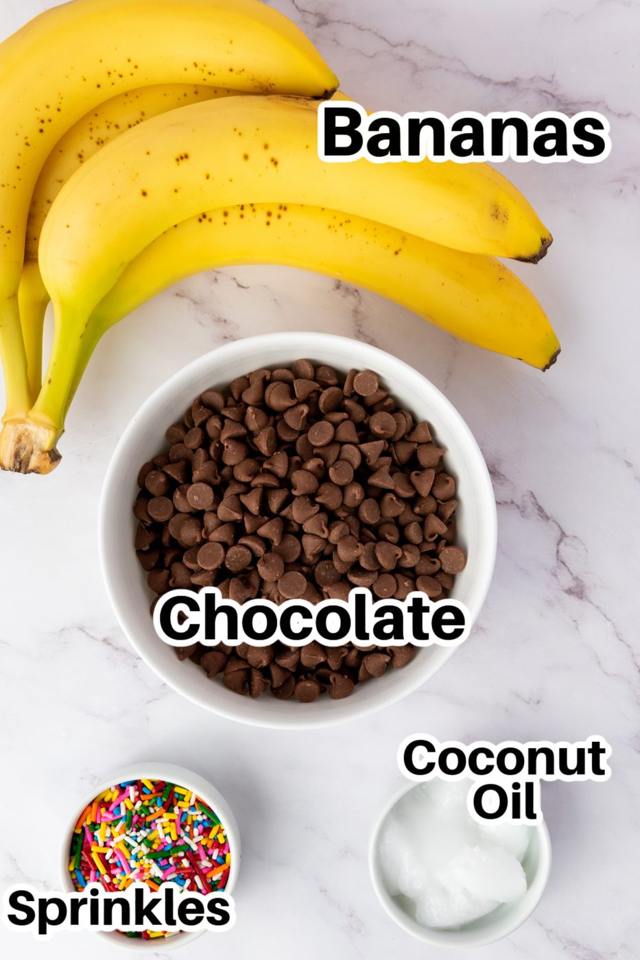 bananas, and bowls of chocolate chips, sprinkles, and coconut oil in bowls on counter