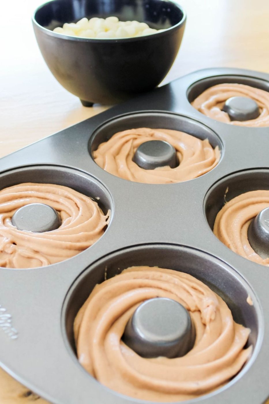 raw chocolate donuts in donut pan 