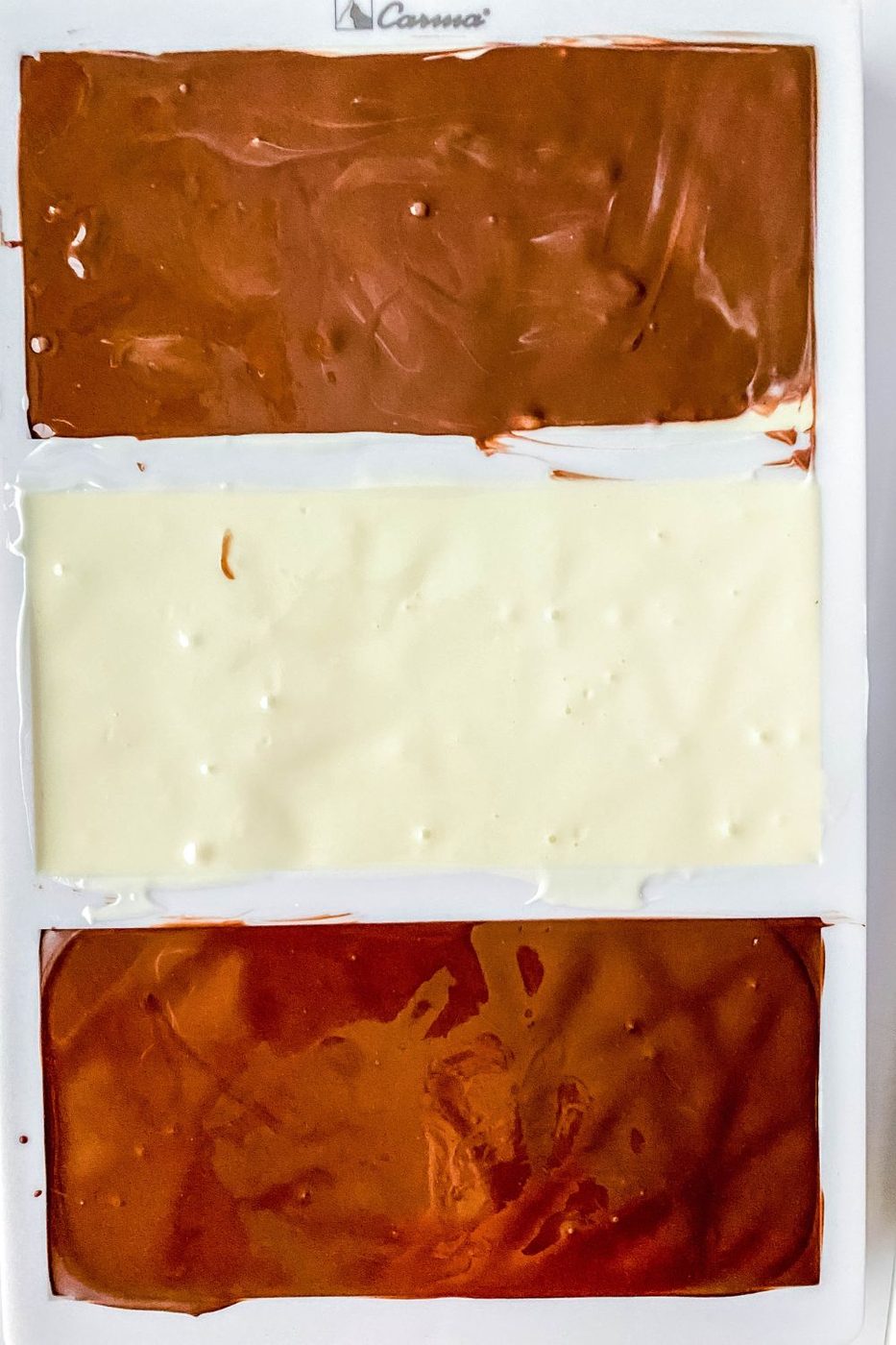 overhead view of chocolate in a silicone candy bar mold