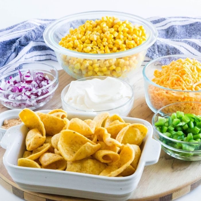ingredients for corn dip on cutting board on table