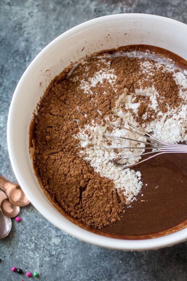 brownie batter in a bowl with whisk