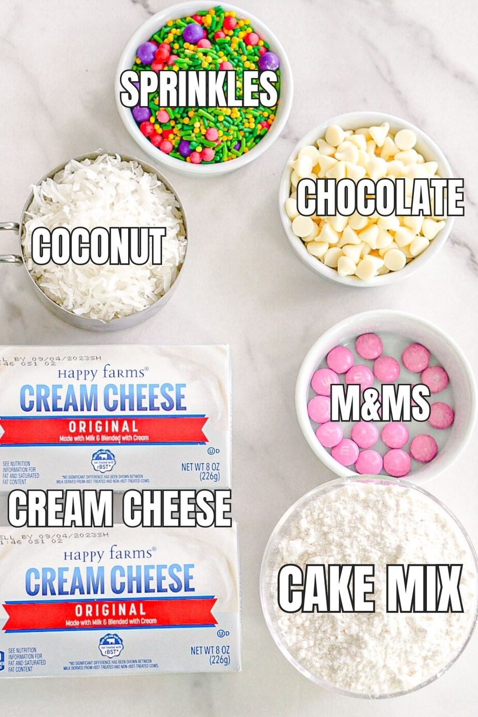 ingredients for a dessert cheeseball on a marble counter