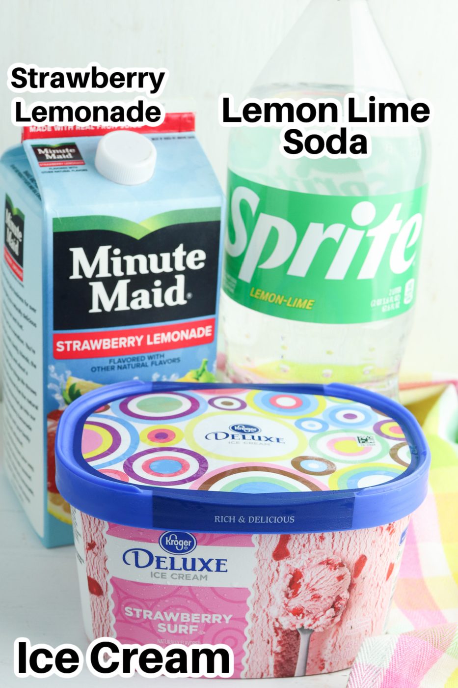 lemonade, sprite and ice cream in containers sitting on table 