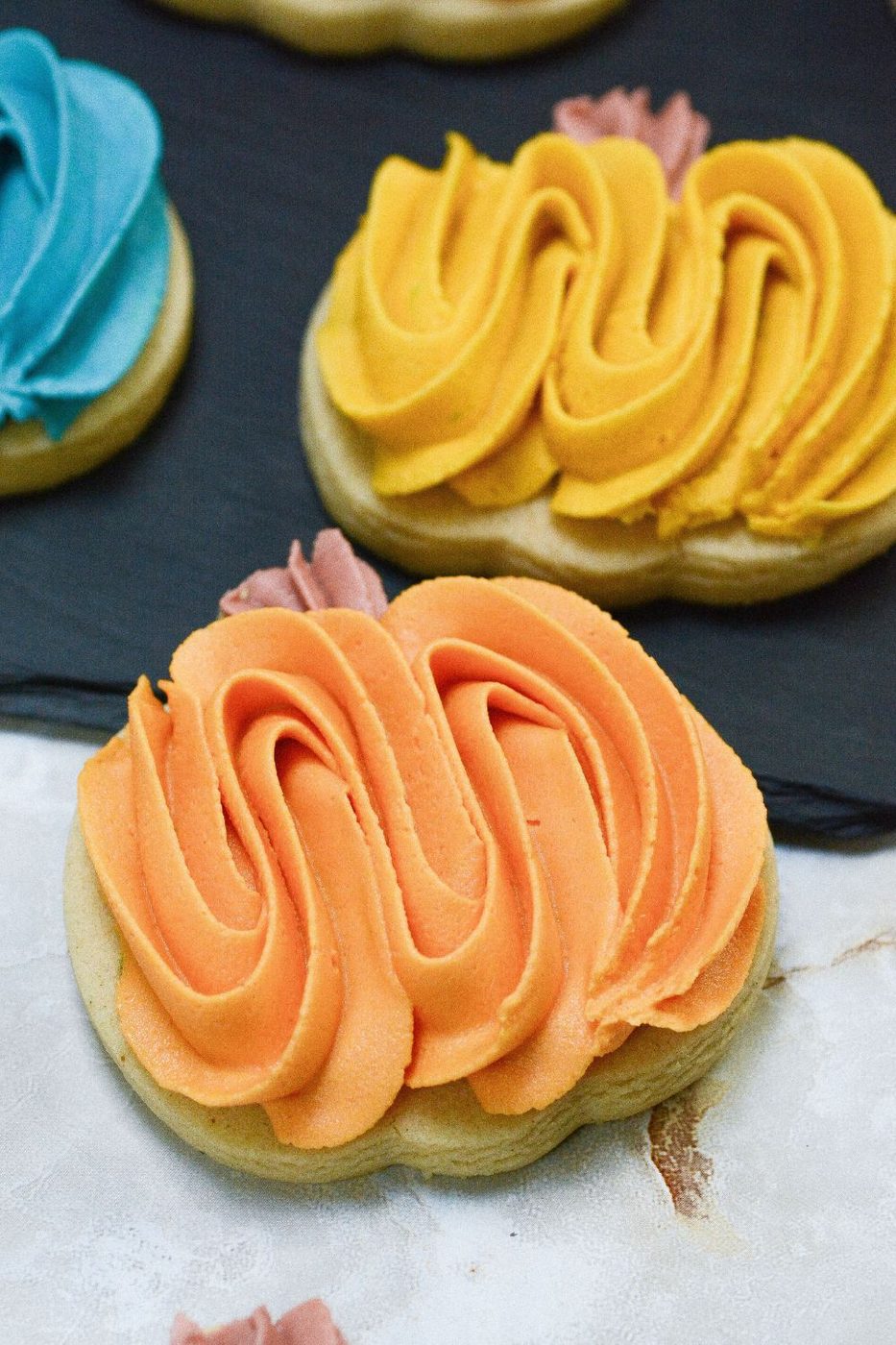 close up of pumpkin cookies on table