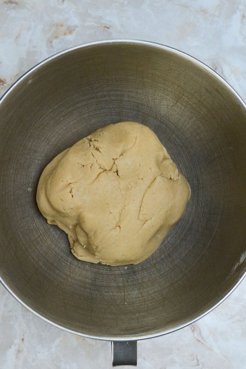 formed cookie dough in a metal bowl