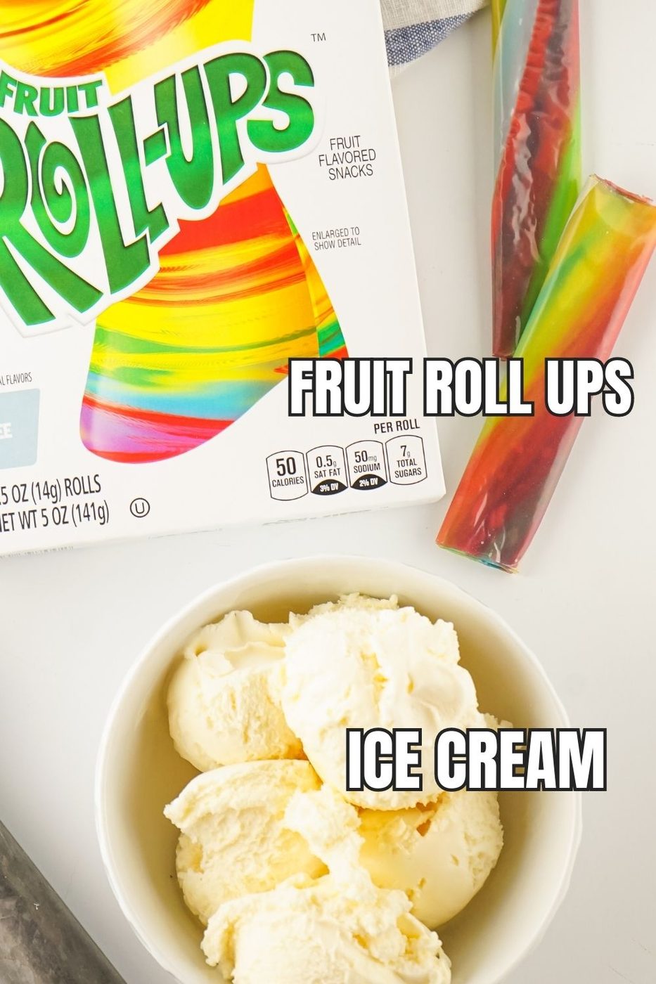 fruit roll up on table and ice cream in a bowl 