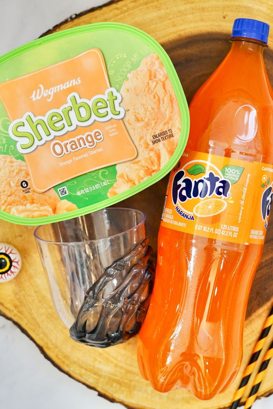 sherbet and orange pop on a wooden cutting board
