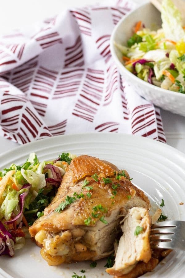chicken thigh cut with salad by it
