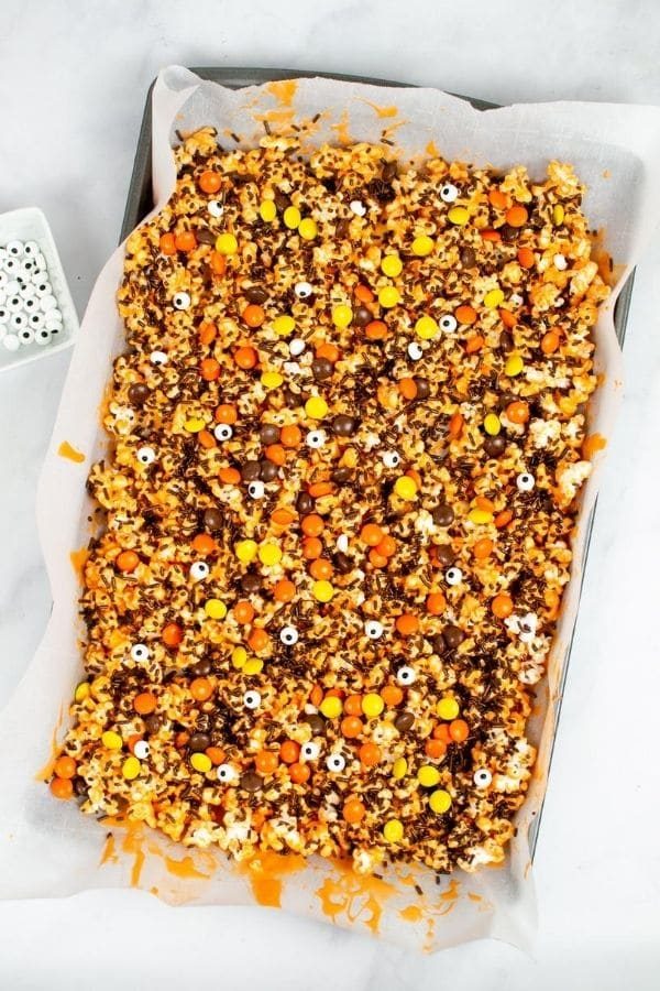 Halloween popcorn mix on sheet pan