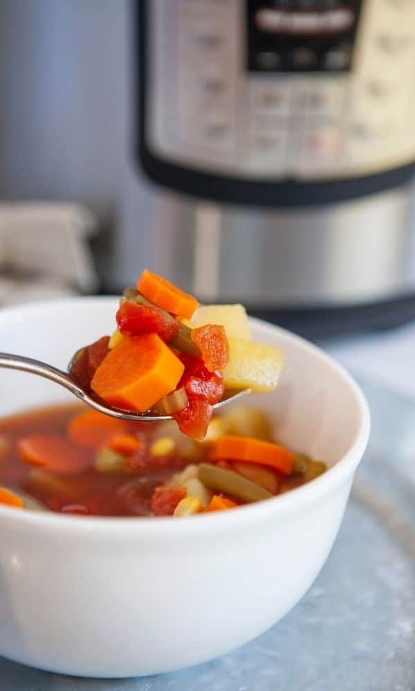 vegetarian soup in a bowl with spoon