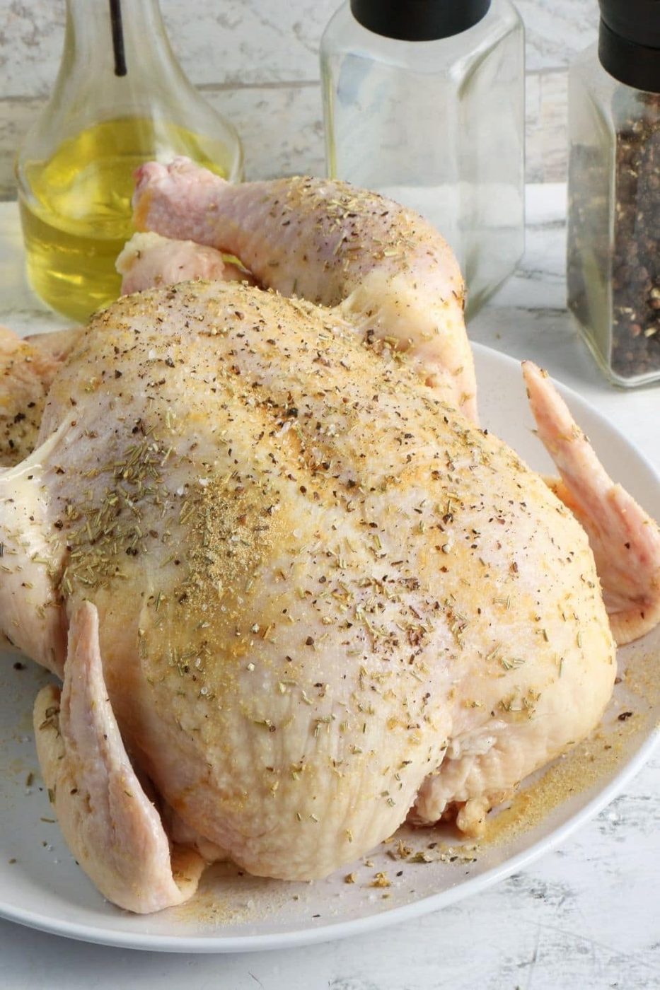 seasoned raw chicken on table