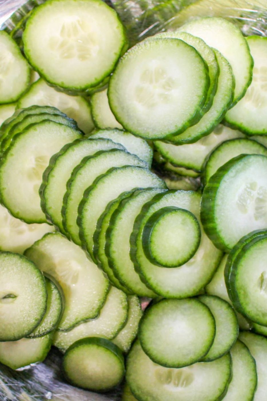 thinly sliced cucumbers in a bowl 