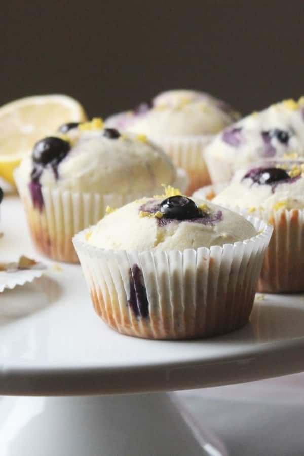 blueberry lemon muffins on a cake stand 