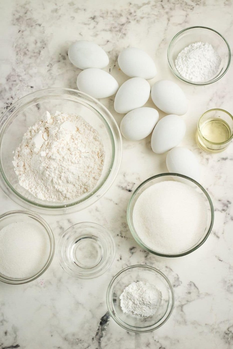 ingredients for lemon loaf on a marble counter