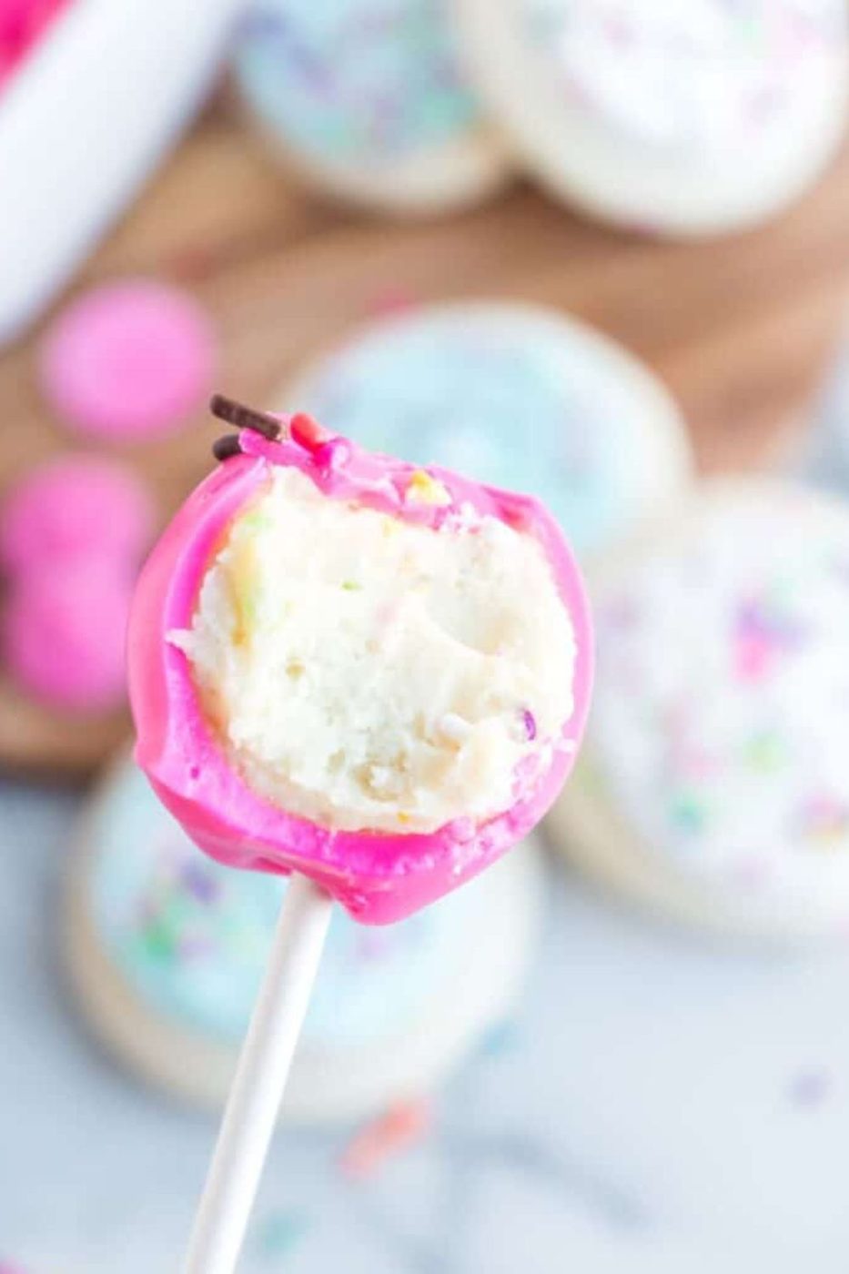 bite taken out of a sugar cookie cake ball 