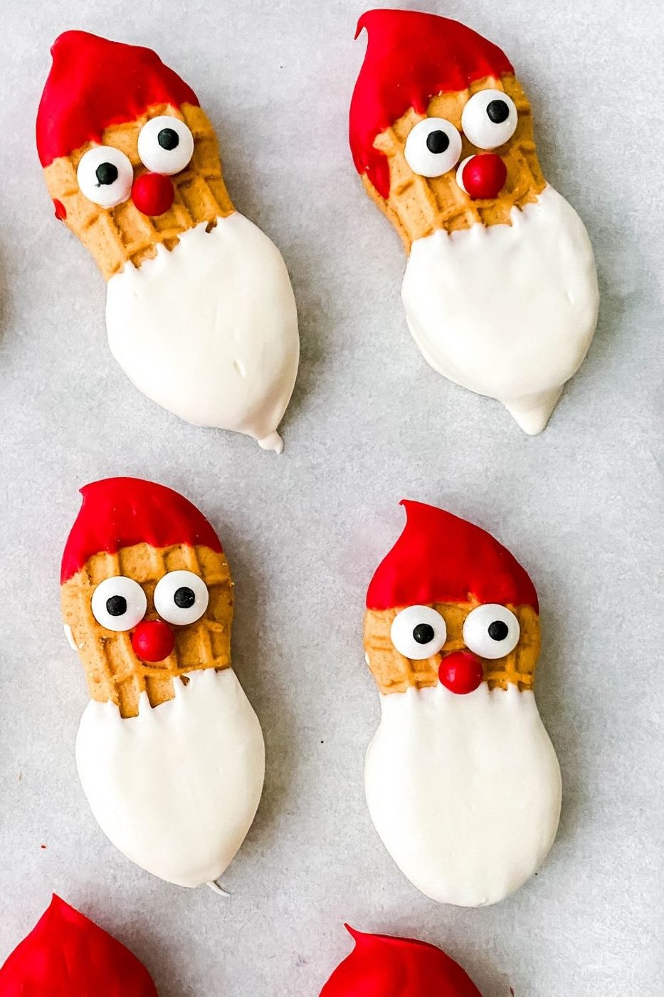 snowman santa cookies on parchment paper