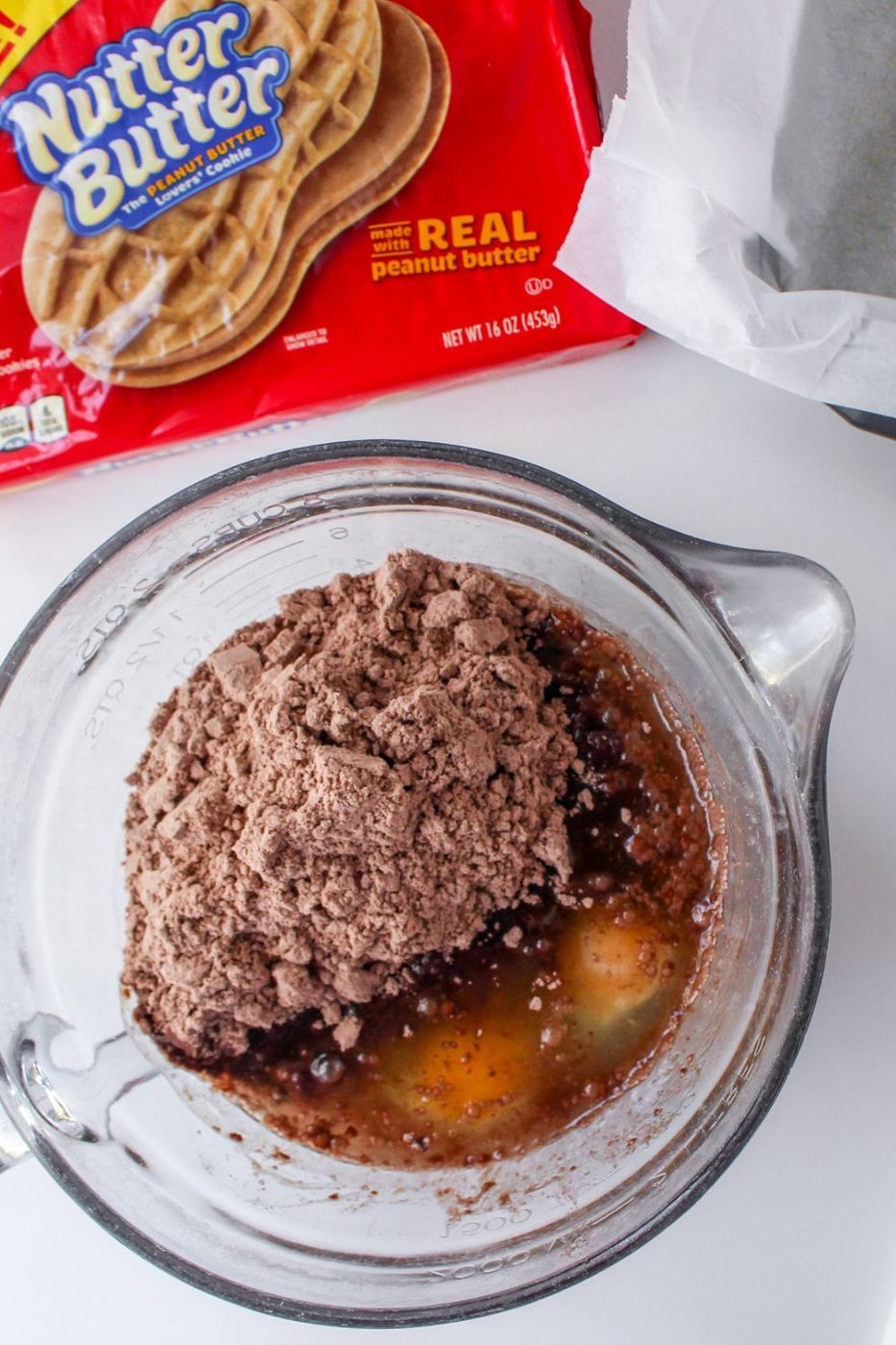 brownie batter in a measuring cup