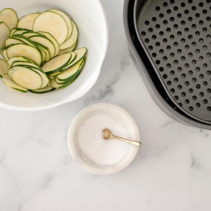 salt and sliced zucchini chips