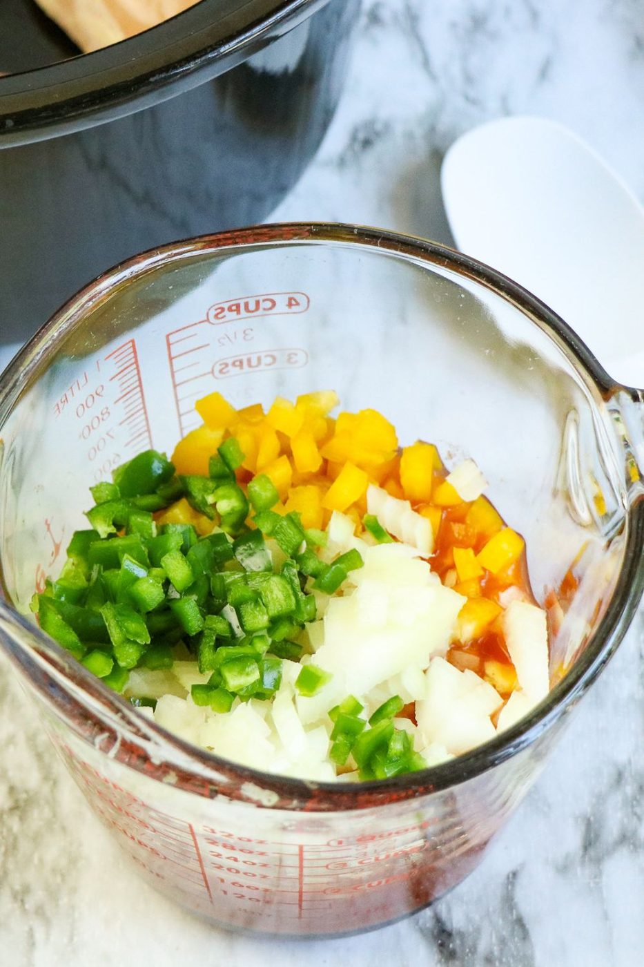 vegetables diced up in measuring cup