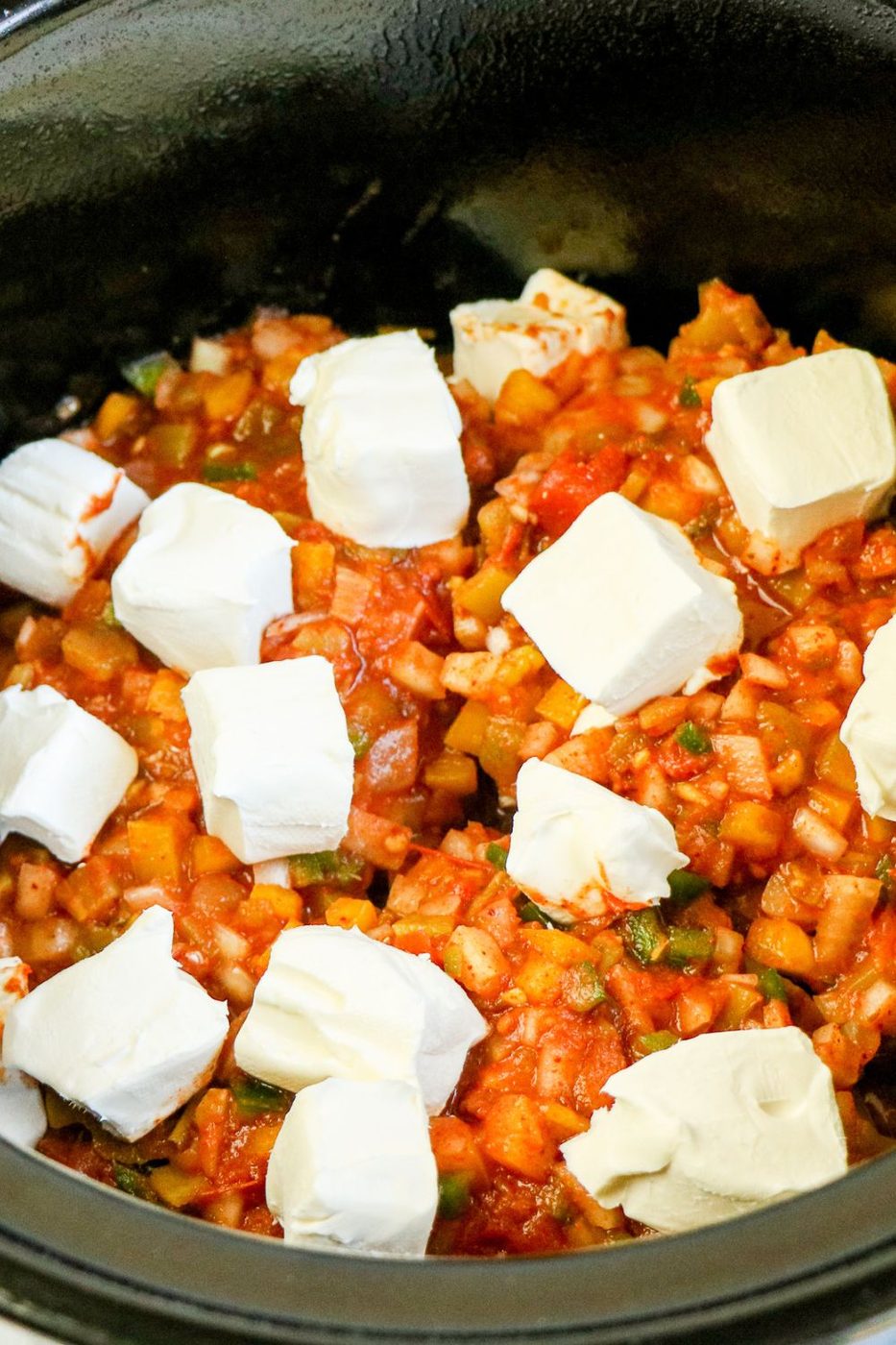 chicken and salsa with cream cheese on top