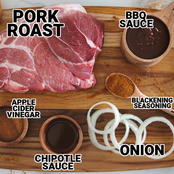 pork roast and ingredients on wooden cutting board