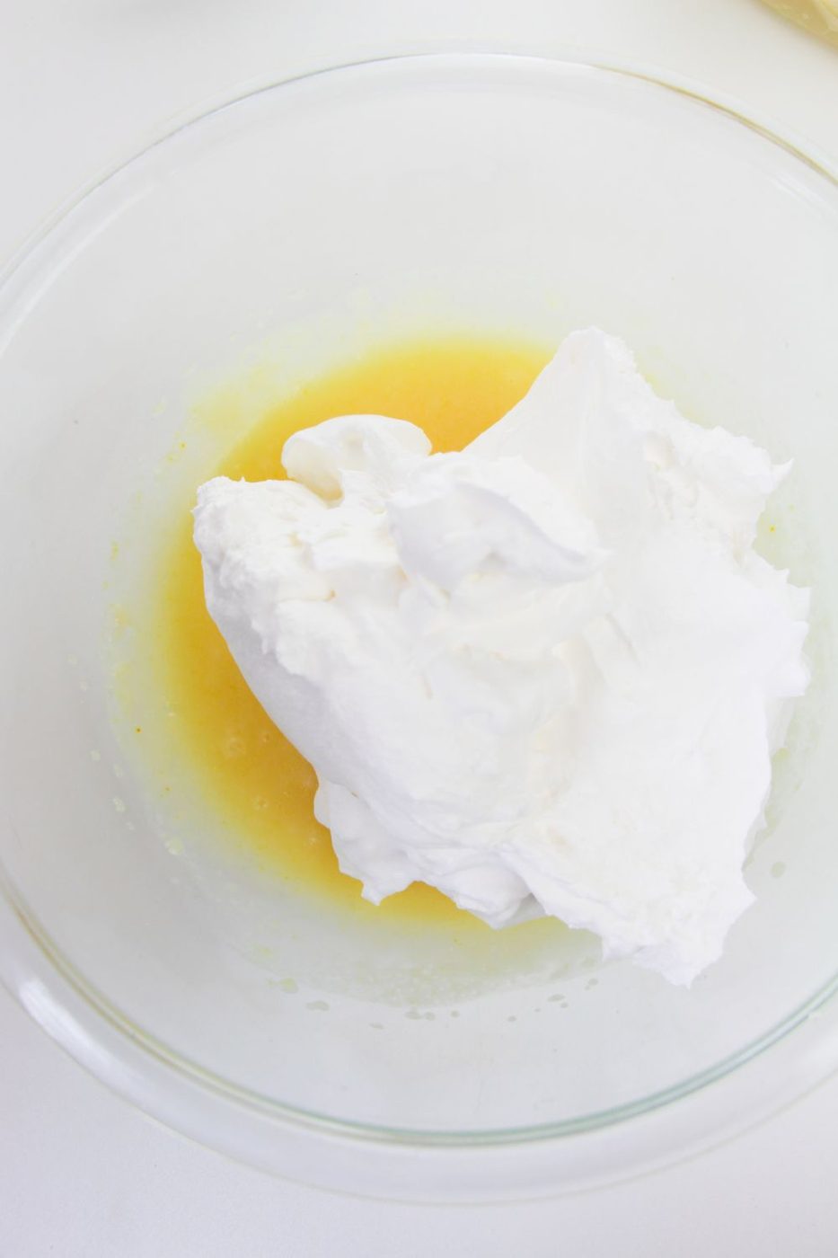pudding and whipped cream mixing up in bowl
