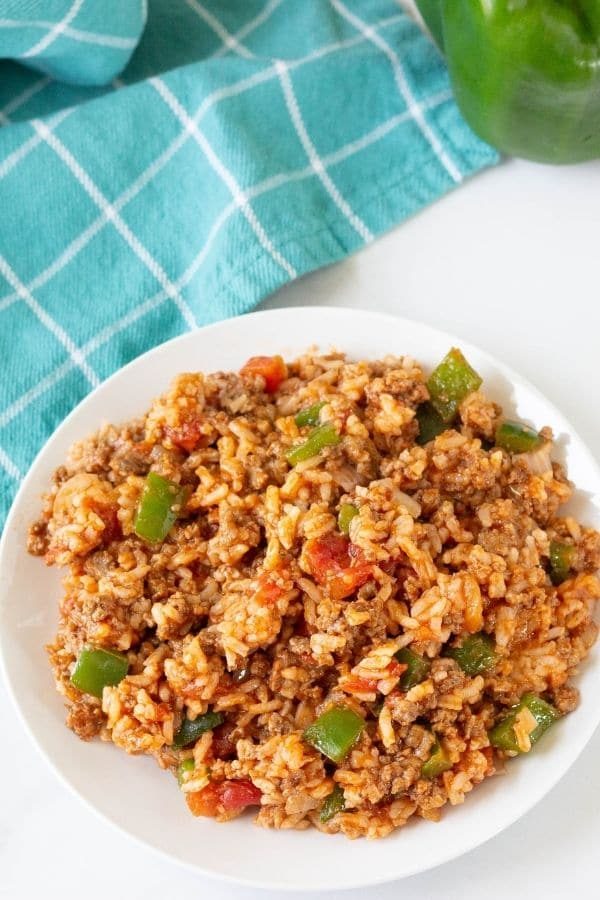 stuffed pepper casserole on a table with towel behind it 