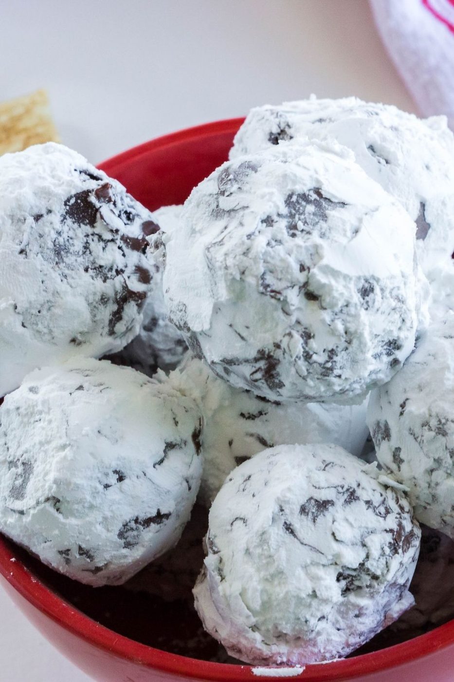 puppy chow truffles in a red bowl side shot 
