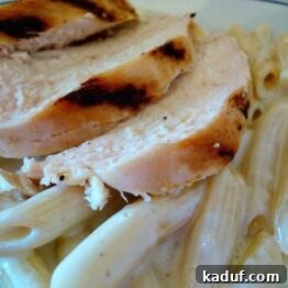 A serving of Penne Gorgonzola Chicken on a white plate, ready to be enjoyed.