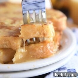 Sweet Tangy Buttermilk Caramel 10 Fork piercing two bites of French toast.