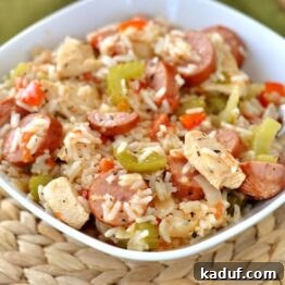A beautifully presented serving of chicken and sausage jambalaya, illustrating its rich textures and colors.