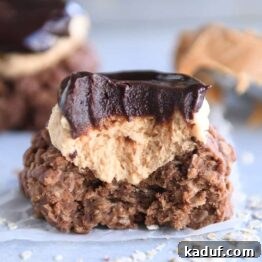 No bake cookie with peanut butter frosting and ganache with bite taken out.