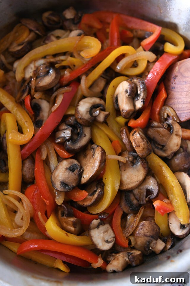 Pan with bell peppers, onions and mushrooms.