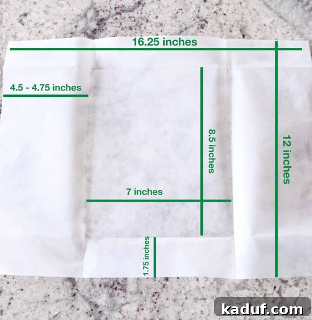 Effortless Twisted Croissant French Bread 5 Parchment paper with lines and dimensions for folding.