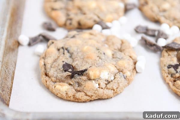 Camp Kitchen Secrets Menus Tips and Resources for Feeding Big Groups 4 S'Mores chocolate chip cookie on parchment lined baking tray.
