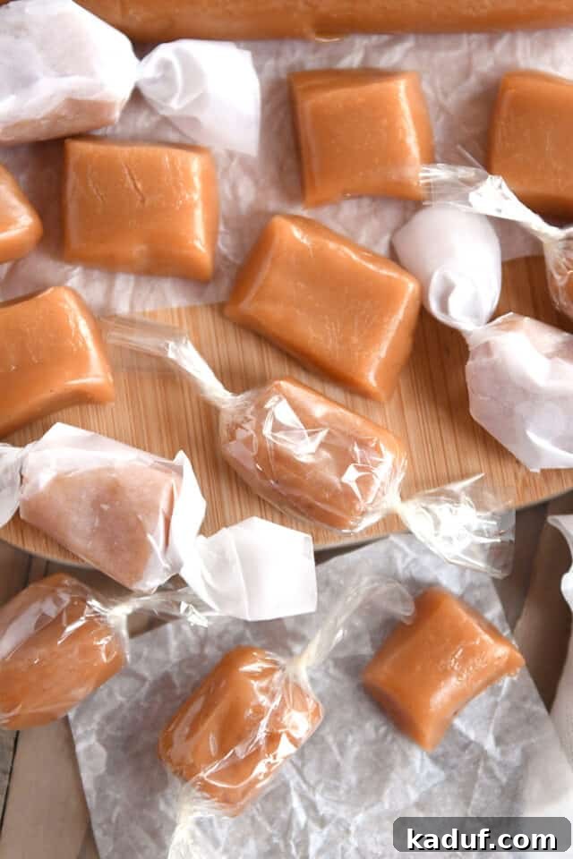 Orchard Cider Caramels 7 A mix of unwrapped caramels alongside wrapped caramels, displayed in both cellophane and parchment paper, showcasing packaging options.