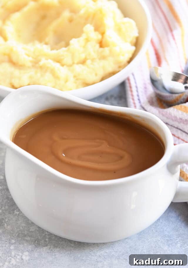 Gravy boat filled with rich brown gravy, ready to be served.