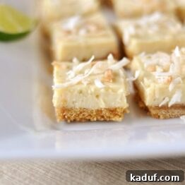Zesty Key Lime Delights 4 Key Lime Bars with toasted coconut topping on a white platter.
