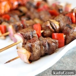 Juicy Steak and Vibrant Vegetable Skewers 4 Grilled Steak and Veggie Kebabs on a platter.