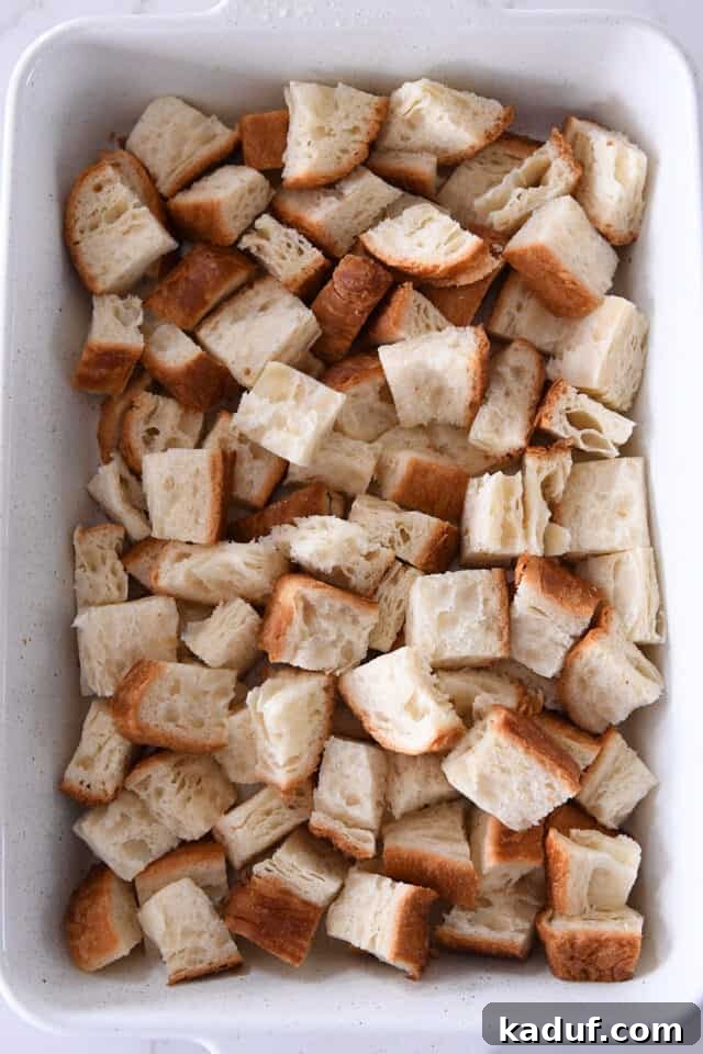 White pan with bread cubes.