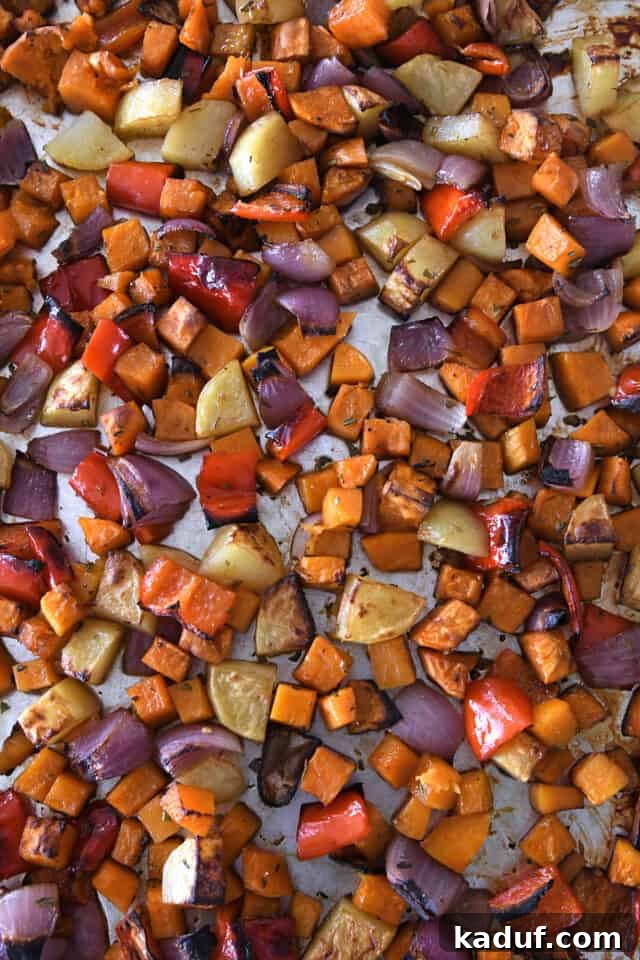 Hearty Balsamic Glazed Root Vegetables 6 A sheet pan filled with beautifully cooked and roasted winter vegetables, golden-brown and tender.