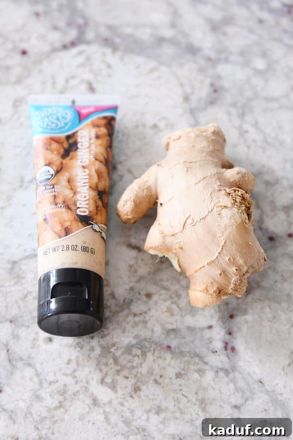 Caramel Coconut Chicken 4 A knob of fresh, unpeeled ginger root positioned next to a tube of ready-to-use ginger paste, illustrating two convenient forms of ginger for cooking.