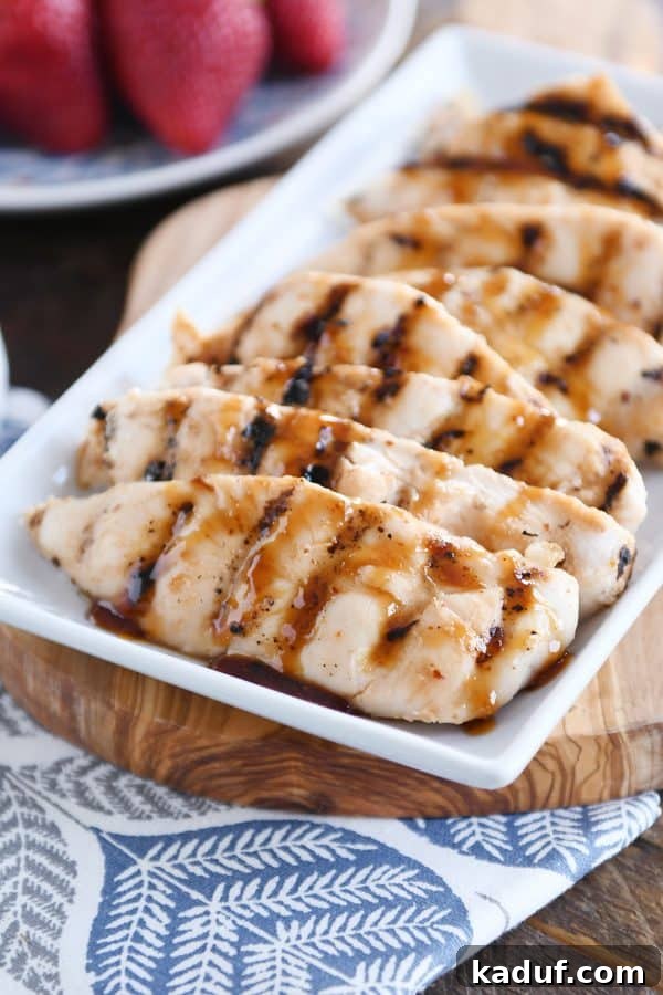 Caramel Coconut Chicken 10 Numerous pieces of perfectly glazed sticky coconut chicken arranged artfully on a large white platter, ready to be served. The chicken glistens under the light with its sweet and spicy coating.